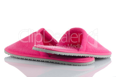 A pair of pink slippers