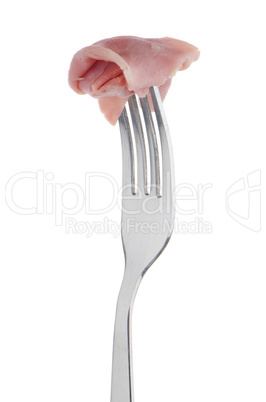 Slice of ham skewered on a fork