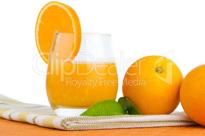 Cup of orange juice and fresh orange