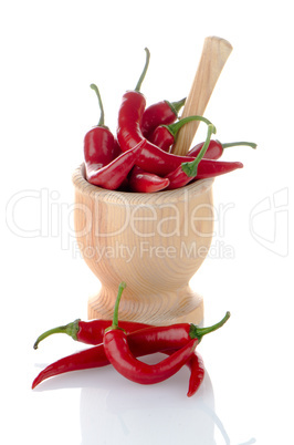 Red chili in wooden mortar