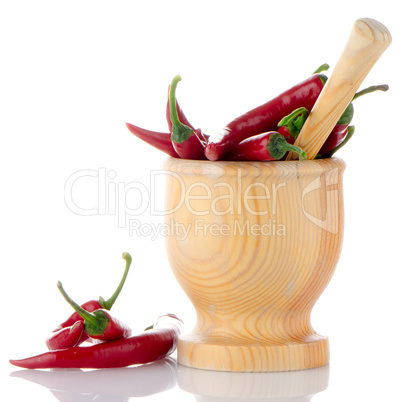 Red chili in wooden mortar