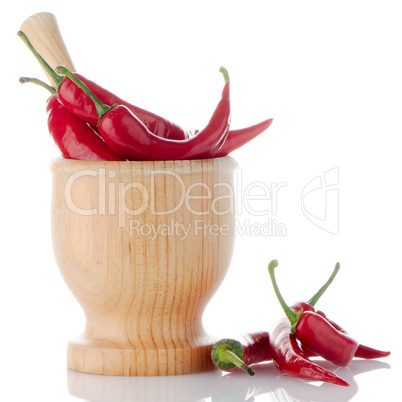 Red chili in wooden mortar