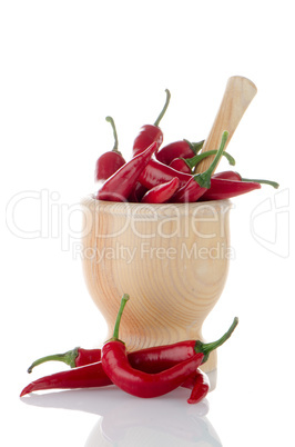 Red chili in wooden mortar