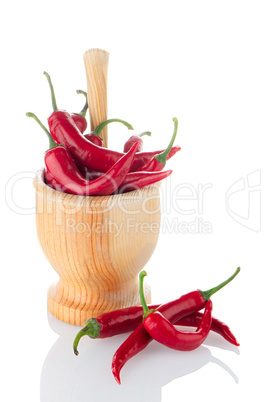 Red chili in wooden mortar