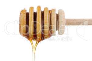Honey on wooden drizzler