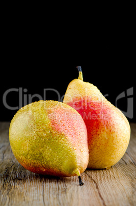 Pears in a old wooden table