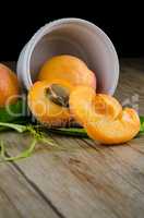 Apricots on wooden table.