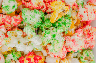 Popped  color kernels of pop corn snack