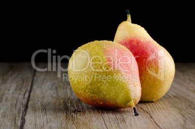 Pears in a old wooden table