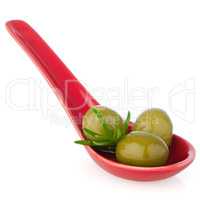 Olives on ceramic spoon