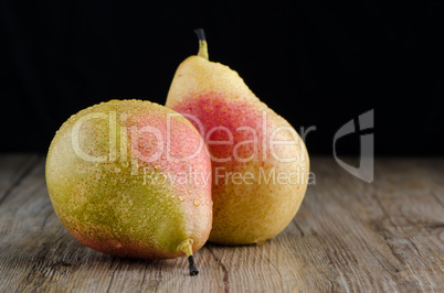 Pears in a old wooden table