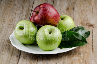 Apples in a ceramic white plate