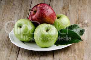 Apples in a ceramic white plate
