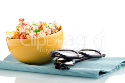 Bowl of popcorn and 3D movie glasses