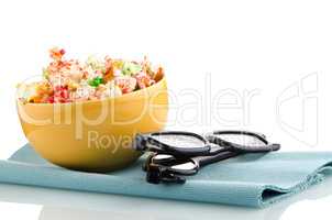 Bowl of popcorn and 3D movie glasses