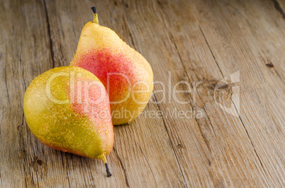 Pears in a old wooden table