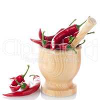 Red chili in wooden mortar