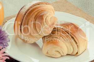 Two croissant on a plate