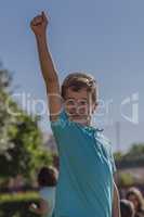 Boy raising his arm