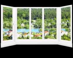 window with beautiful view to country houses and lake