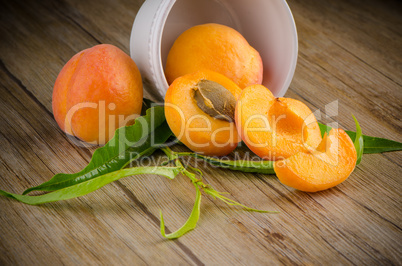 Apricots on wooden table.