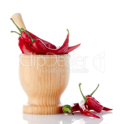 Red chili in wooden mortar