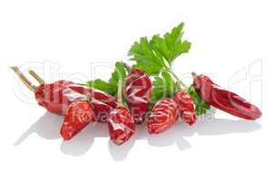 Red chili or chilli pepper and parsley leaves