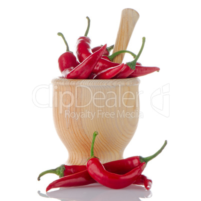 Red chili in wooden mortar