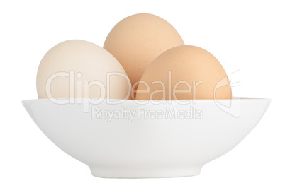Brown eggs in white ceramic bowl