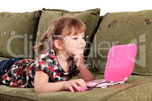 little girl play with laptop