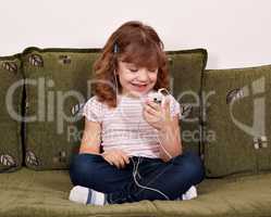 happy little girl listening music