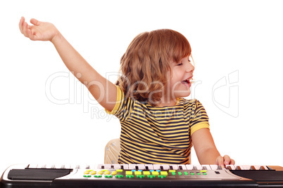 little girl play music on keyboard