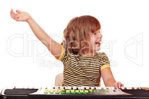 little girl play music on keyboard