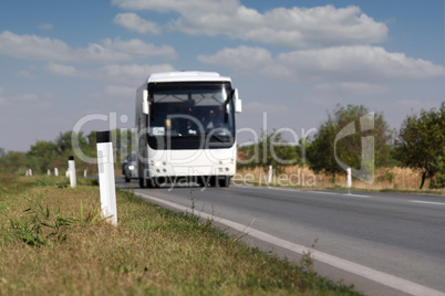 white bus on the road