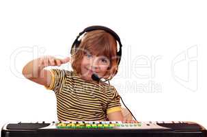 happy little girl play keyboard