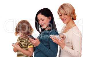 little girl teenage girl and woman playing with smart phone and