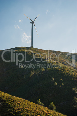 Wind turbine on a hill