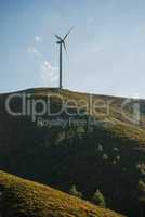 Wind turbine on a hill