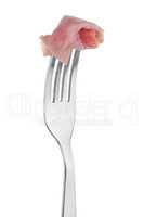 Slice of ham skewered on a fork