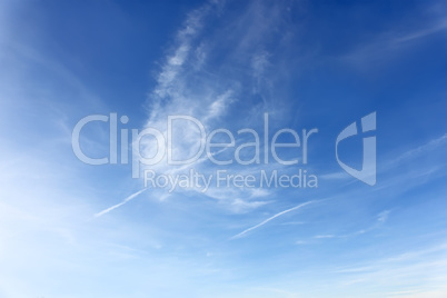 Amazing cloudscape with airplanes tracks