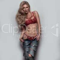 sexy blonde woman wearing jeans and lingerie