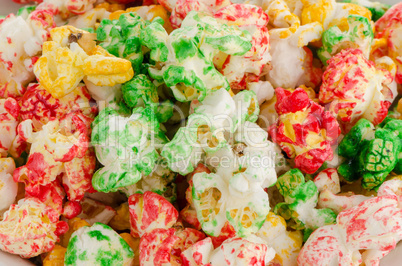 Popped  color kernels of pop corn snack