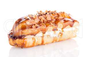 Eclair with caramel decoration