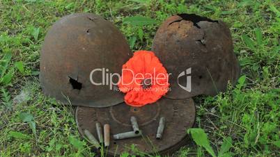 red poppy on the helmet of a dead soldier