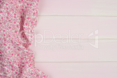 Pink towel over wooden table