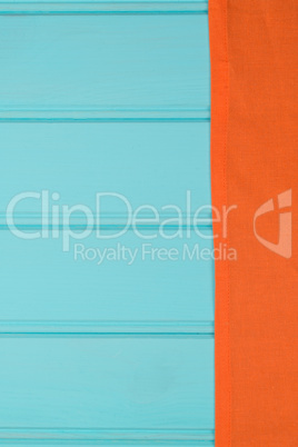 Orange towel over wooden table