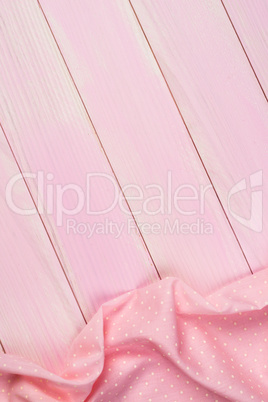 Pink towel over wooden table