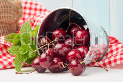 Cherries in small metal bucket