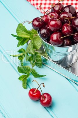 Cherries in blue wooden table