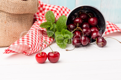 Cherries in small metal bucket